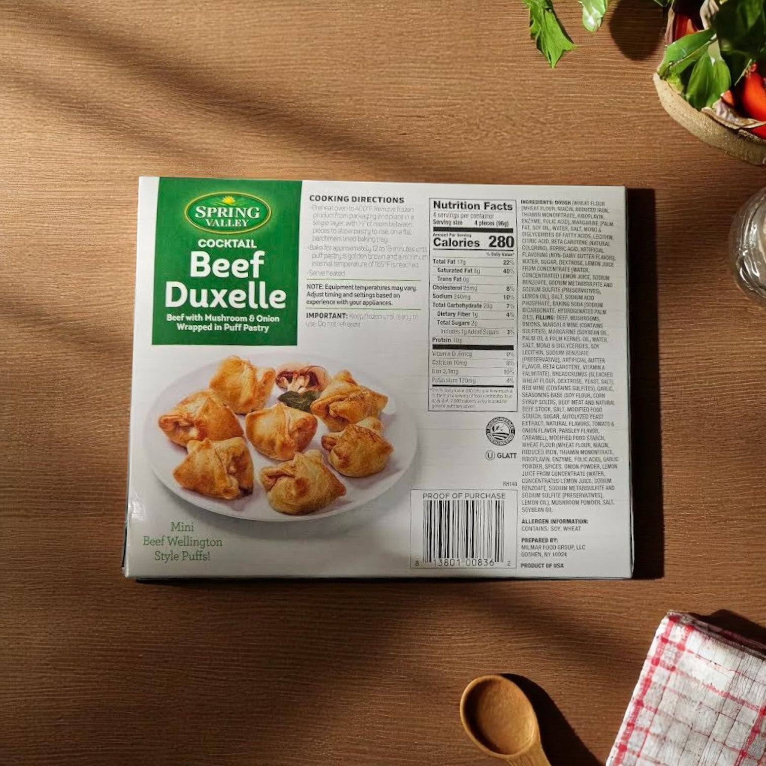 Spring Valley Cocktail Beef Duxelle Mini Beef Wellington Style Puffs, 13.6 oz, 16 pieces per pack (12 packs/case), shown with nutrition facts, cooking directions, and a product photo displayed on a wooden table.