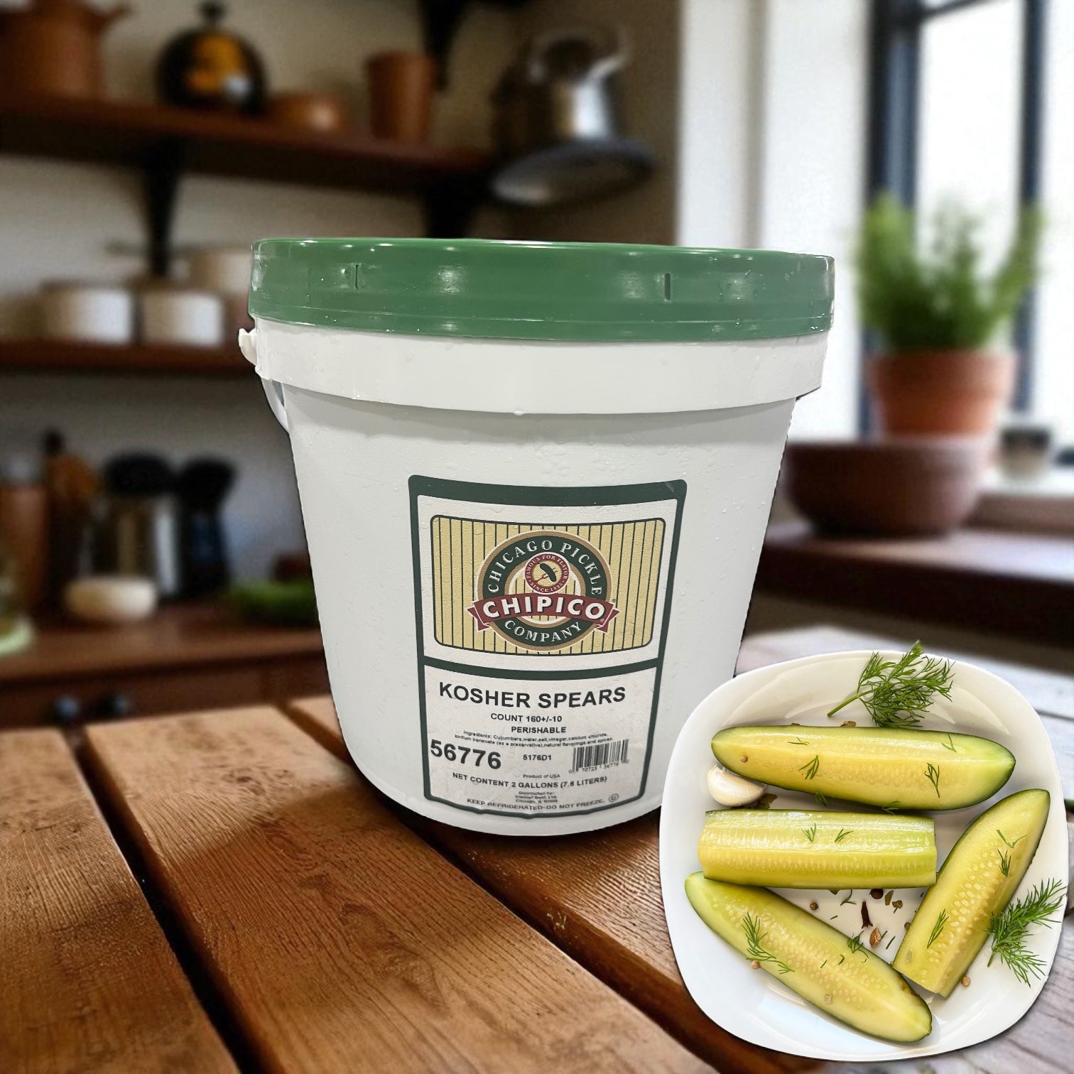 A 2-gallon jar of Vienna Beef Chipico Kosher Spears (160±10 spears) sits on a wooden table beside a bowl of dill-garnished pickle spears—perfect for classic Chicago hot dog relish fans in any kitchen or foodservice setting.