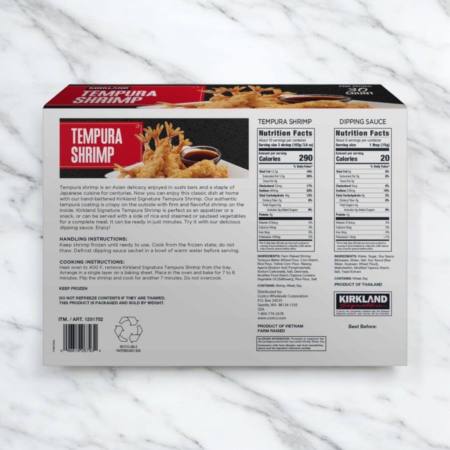 Back of a Kirkland Signature Tempura Shrimp, 2.35 lbs, 30-count box on a marble surface, showing product image, description, nutrition facts, cooking instructions, and handling tips for perfectly crispy shrimp.