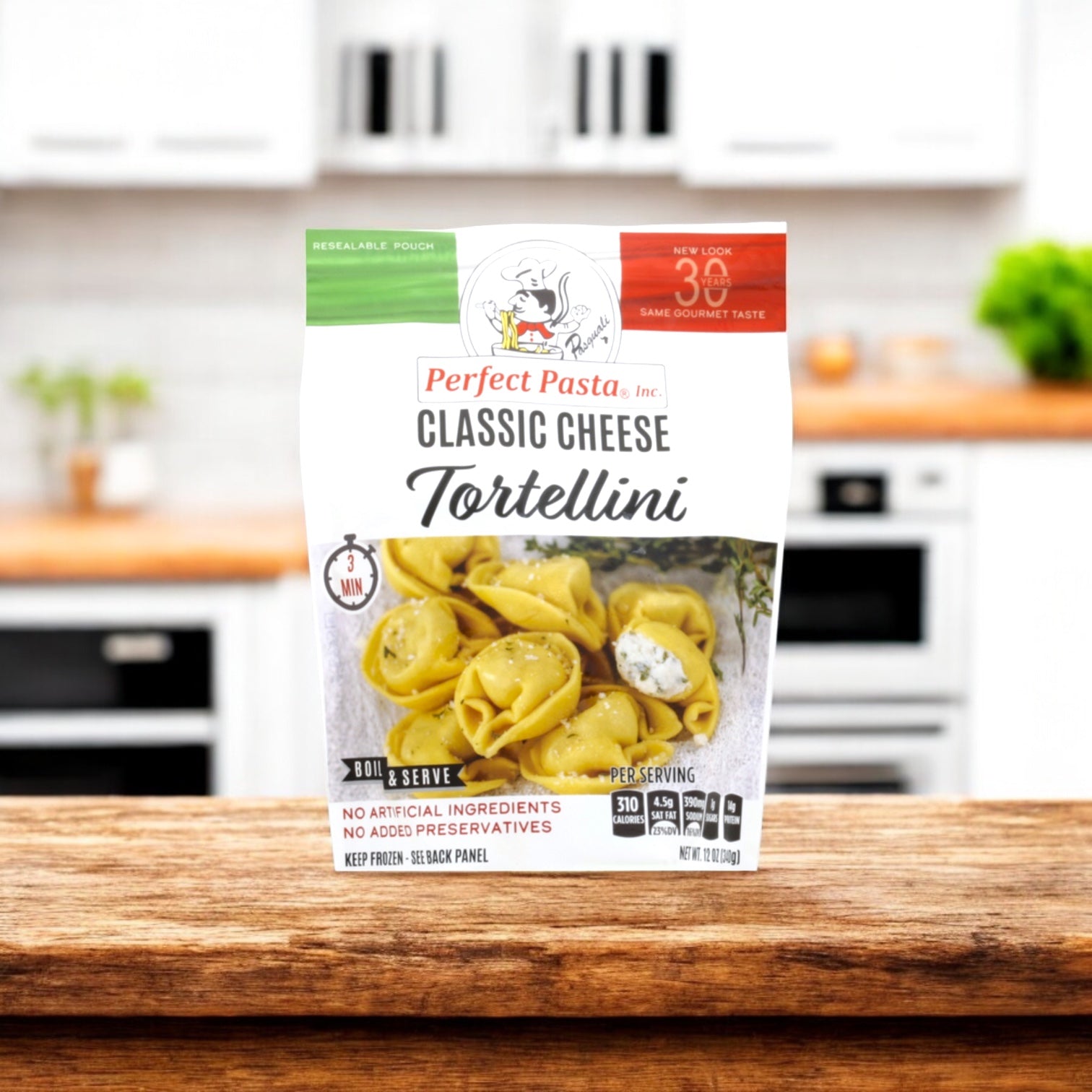 A pack of Perfect Pasta Classic Cheese Tortellini from Perfect Pasta is shown on a wooden counter in a modern kitchen.