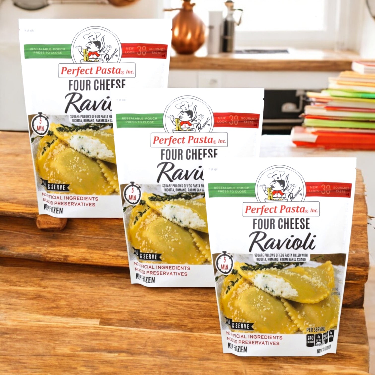 Three packs of Perfect Pasta Four Cheese Ravioli by Perfect Pasta are displayed on a wooden kitchen counter, highlighting this Italian-inspired meal in a bright kitchen setting.