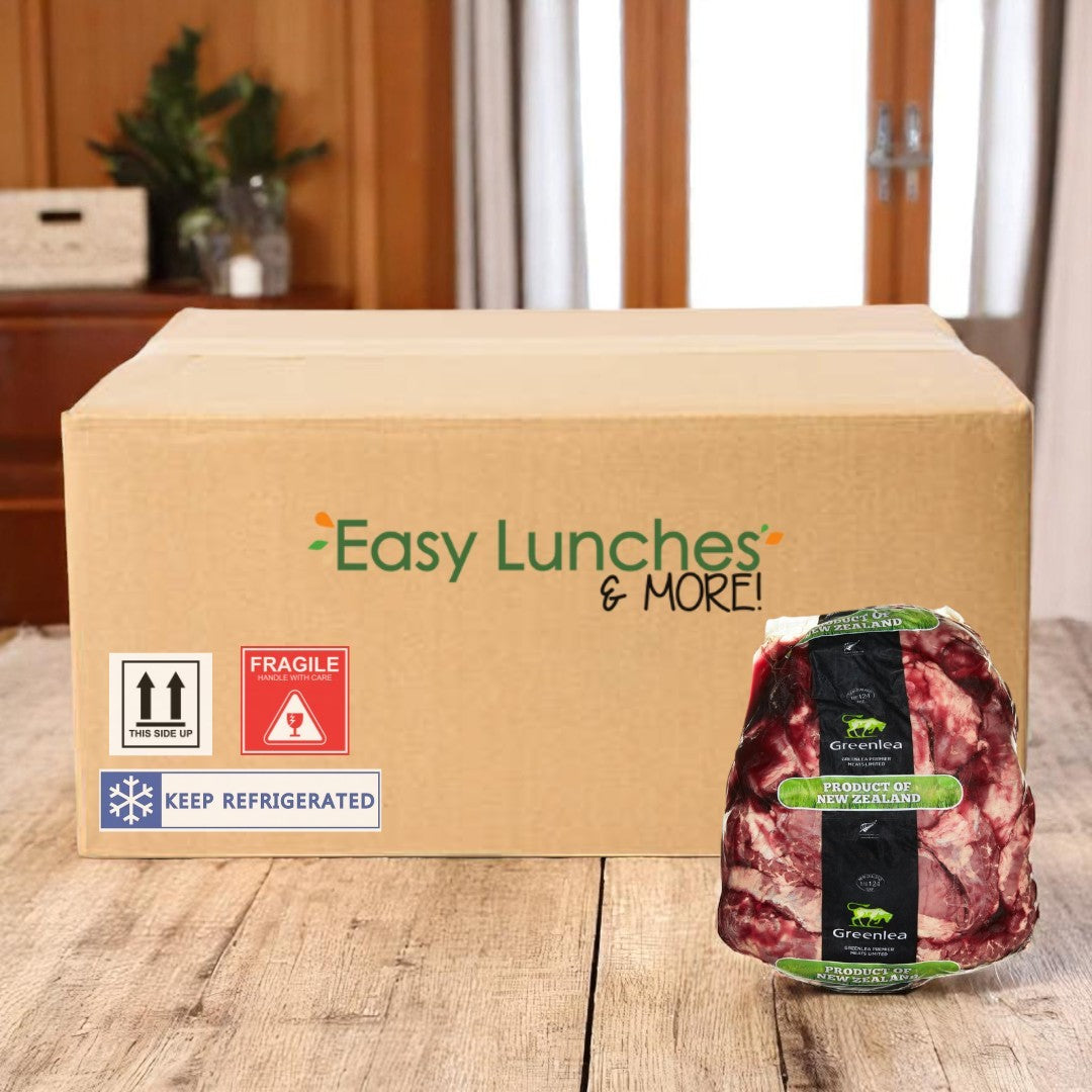 A cardboard box labeled "Easy Lunches" sits on a table next to a vacuum-sealed package of Peeled Inside Skirt Steak—5 lbs, 1 case.