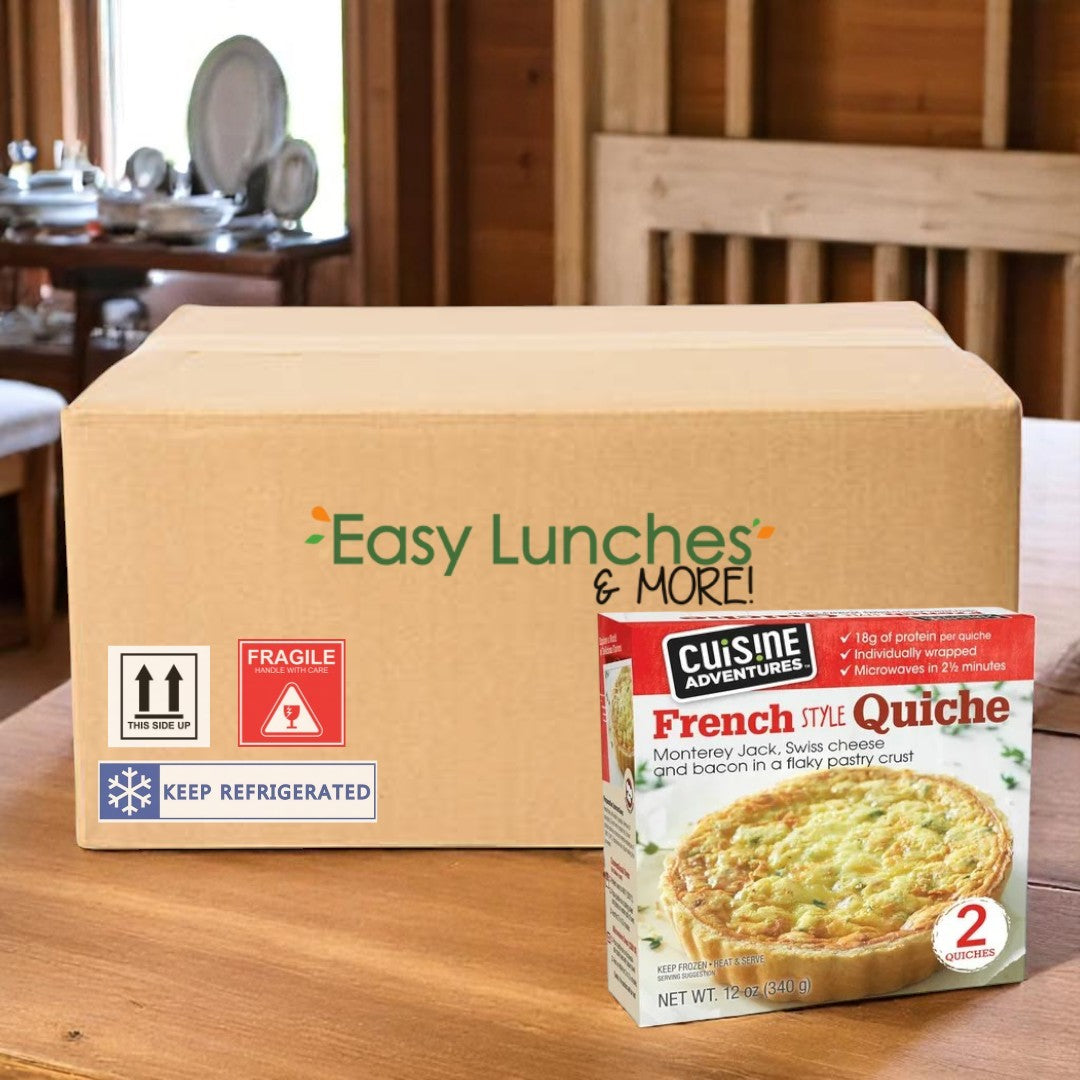 A cardboard box labeled "Easy Lunches & More!" sits on a table with a Cuisine Adventure French Style Quiche- 2 Count- 1 Case in front—perfect for enjoying gourmet quiche with a delicate, flaky pastry crust.