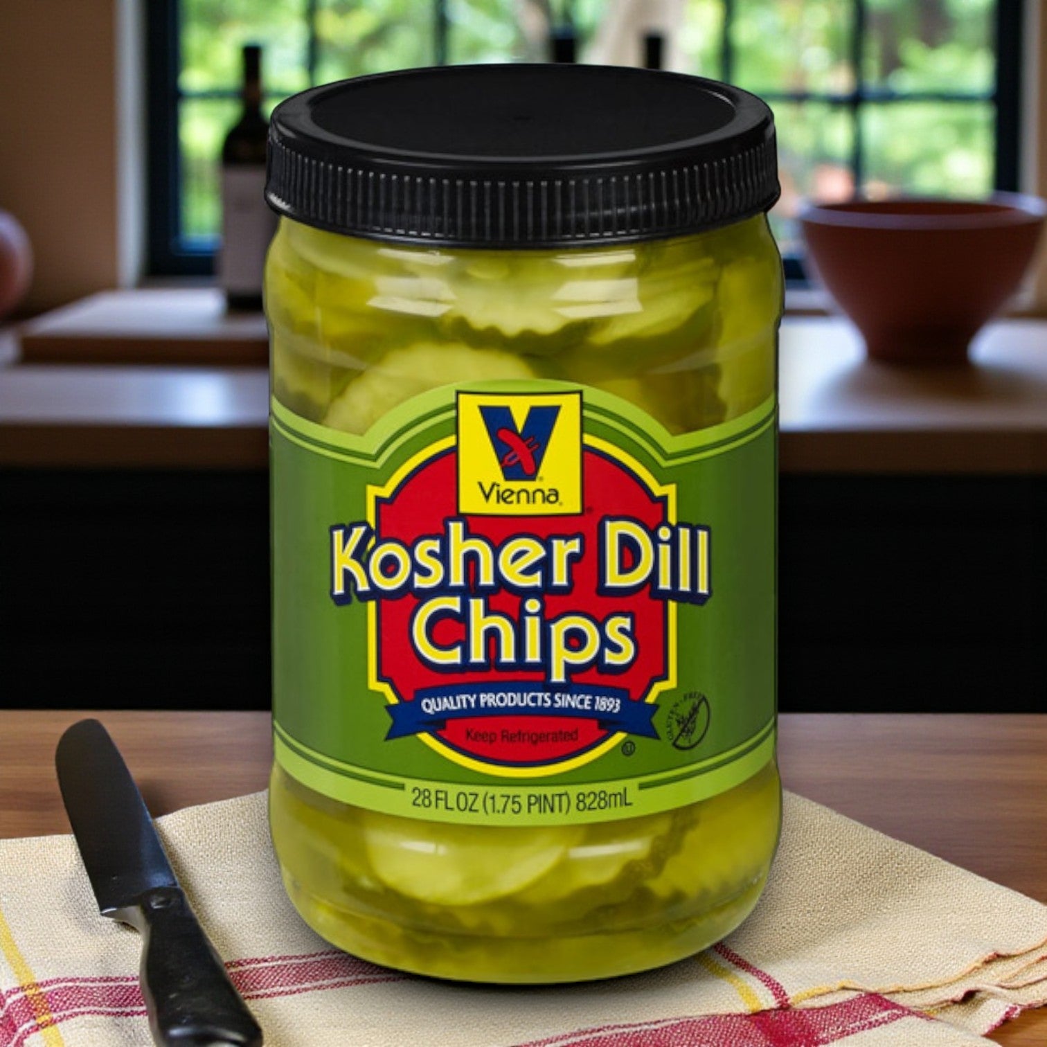 A Billy Goat Tavern Burger Combo sits on the counter, featuring S. Rosen’s Kaiser Buns and Vienna Beef Dill Chips—crisp and tangy, the perfect side for a classic Chicago meal. A knife, folded towel, and kitchen items complete the scene.