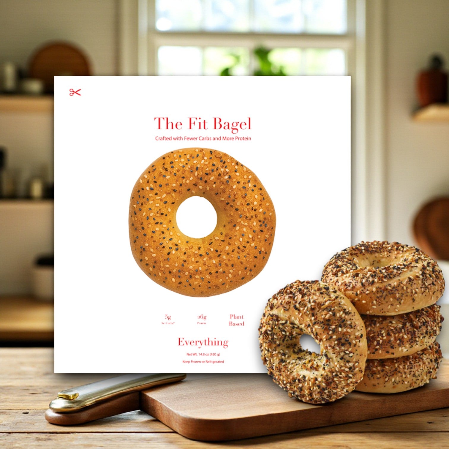 A box labeled "The Fit Bagel" displays the Better Brand Bagel & Fit Bagel Variety Pack—8 bags (32 bagels: 2 Classic, 2 Pretzel Buns, 2 Sesame, 2 Everything)—beside a stack of bagels on a wooden board in a cozy kitchen.