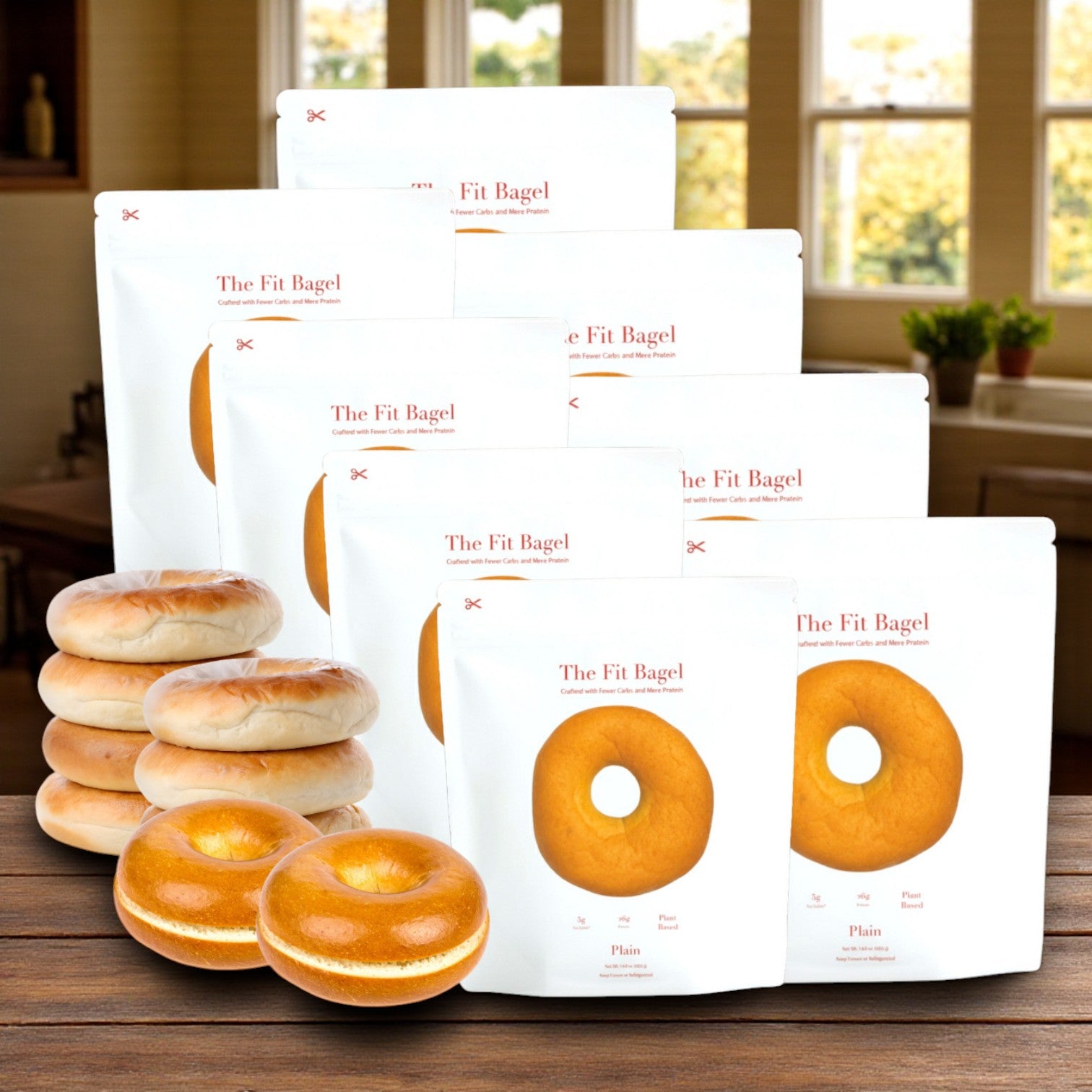 Multiple packs of The Fit Bagel’s 8 Plain Fit Bagels (8 bags, 32 bagels total) are displayed in a kitchen, showcasing these high-protein bagels and their branded packaging.