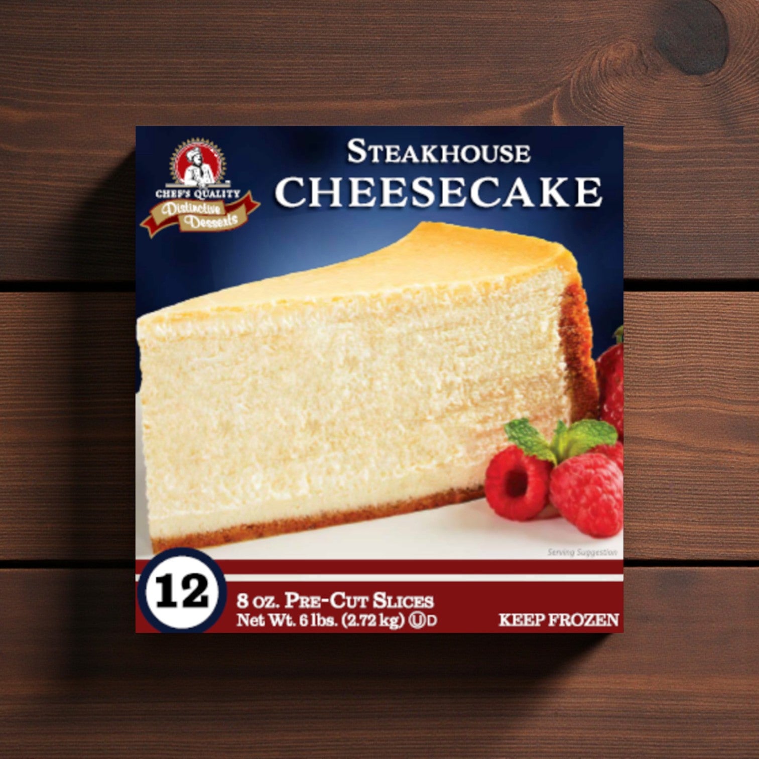 Easy Lunches Frozen Chef's Quality Steakhouse Style Cheesecake features a large, pre-sliced cheesecake with a graham cracker crust and raspberry garnish. This 6 lb frozen dessert includes 12 slices.