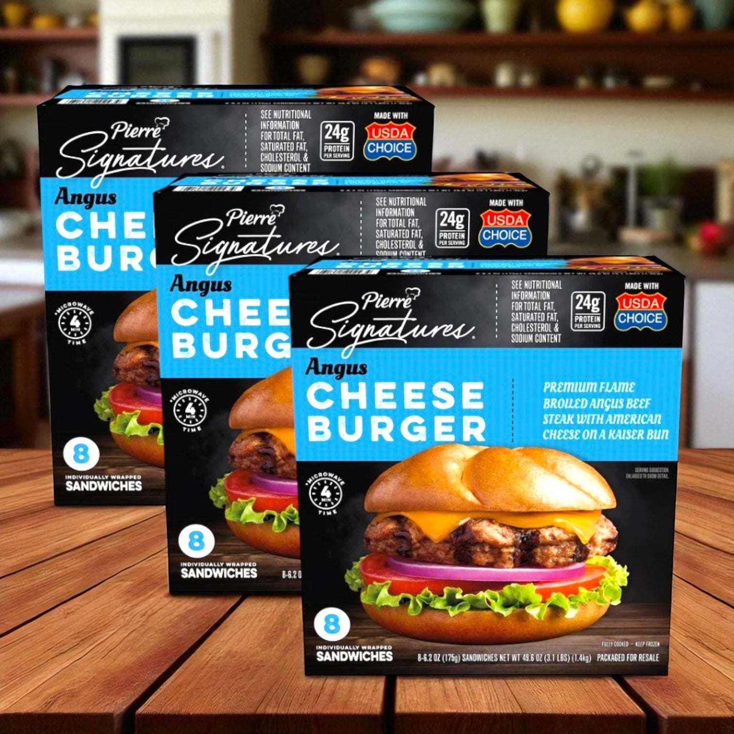 Three boxes of Chef Pierre Signatures Angus Cheeseburger, 6.2 oz, 8 ct –3 Pack are displayed on a kitchen counter, each box showing mouth-watering microwave-ready burgers made with premium Angus beef on the packaging.
