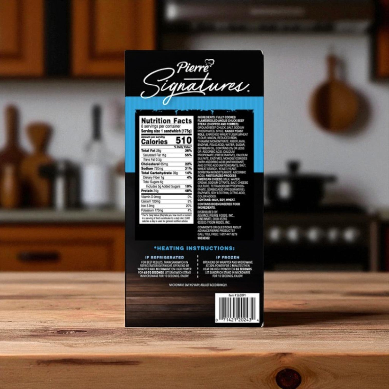 A package of Chef Pierre Pierre Signatures Angus Cheeseburger, 6.2 oz, 8 ct –3 Pack sits on a kitchen counter, showing nutrition facts, ingredients, and microwave heating instructions.