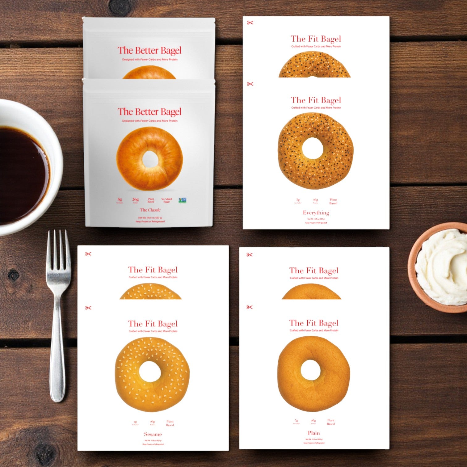 An assortment of The Fit Bagel's Better Brand Bagel & Fit Bagel Variety Pack—Classic, Pretzel Buns, Sesame, and Everything—are set on a wooden table beside coffee, utensils, and a bowl of cream cheese.