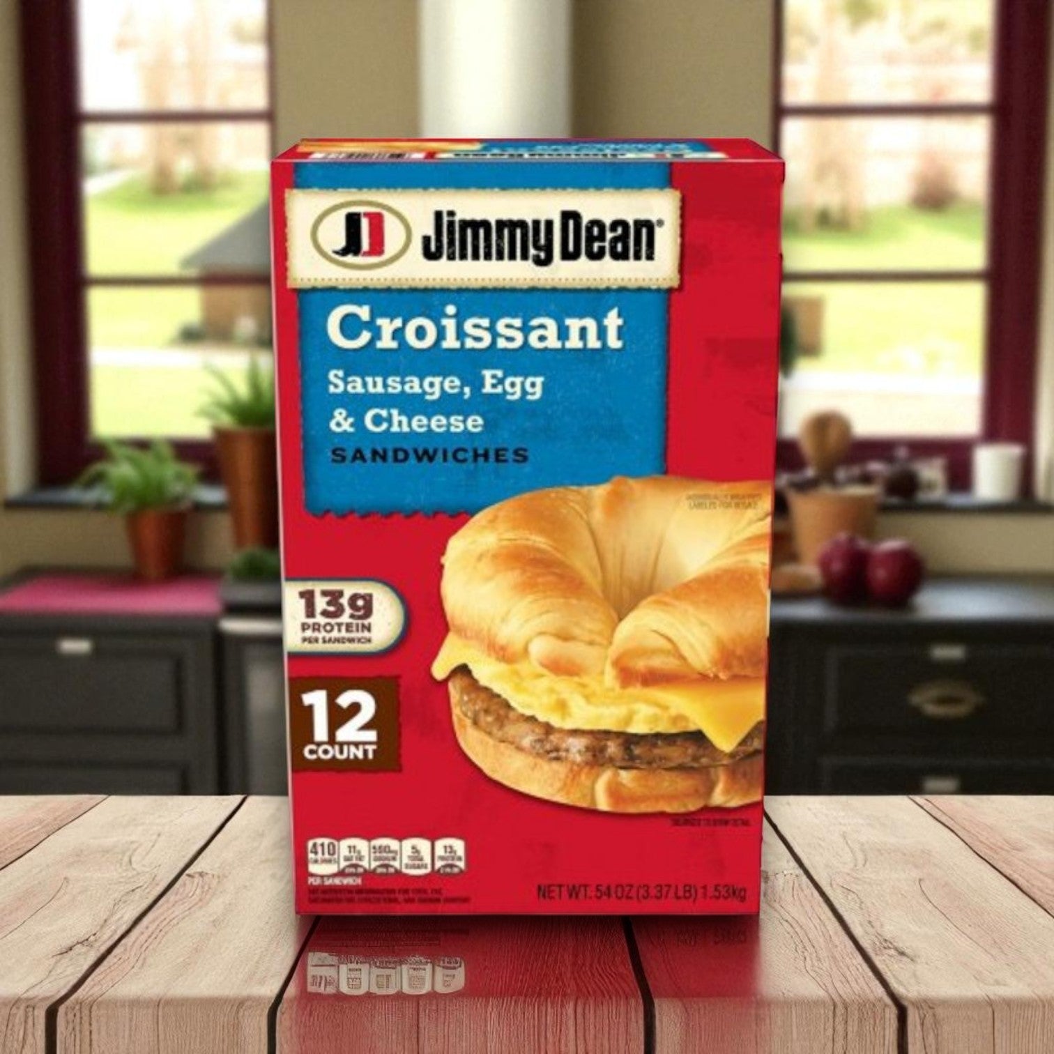 A Jimmy Dean Breakfast Variety Pack featuring Griddle Cake Sandwiches, Croissant Sandwiches, and Meat Lovers Bowls (12 or 8 count) offers a protein-packed breakfast and sits on a kitchen counter in front of a window.