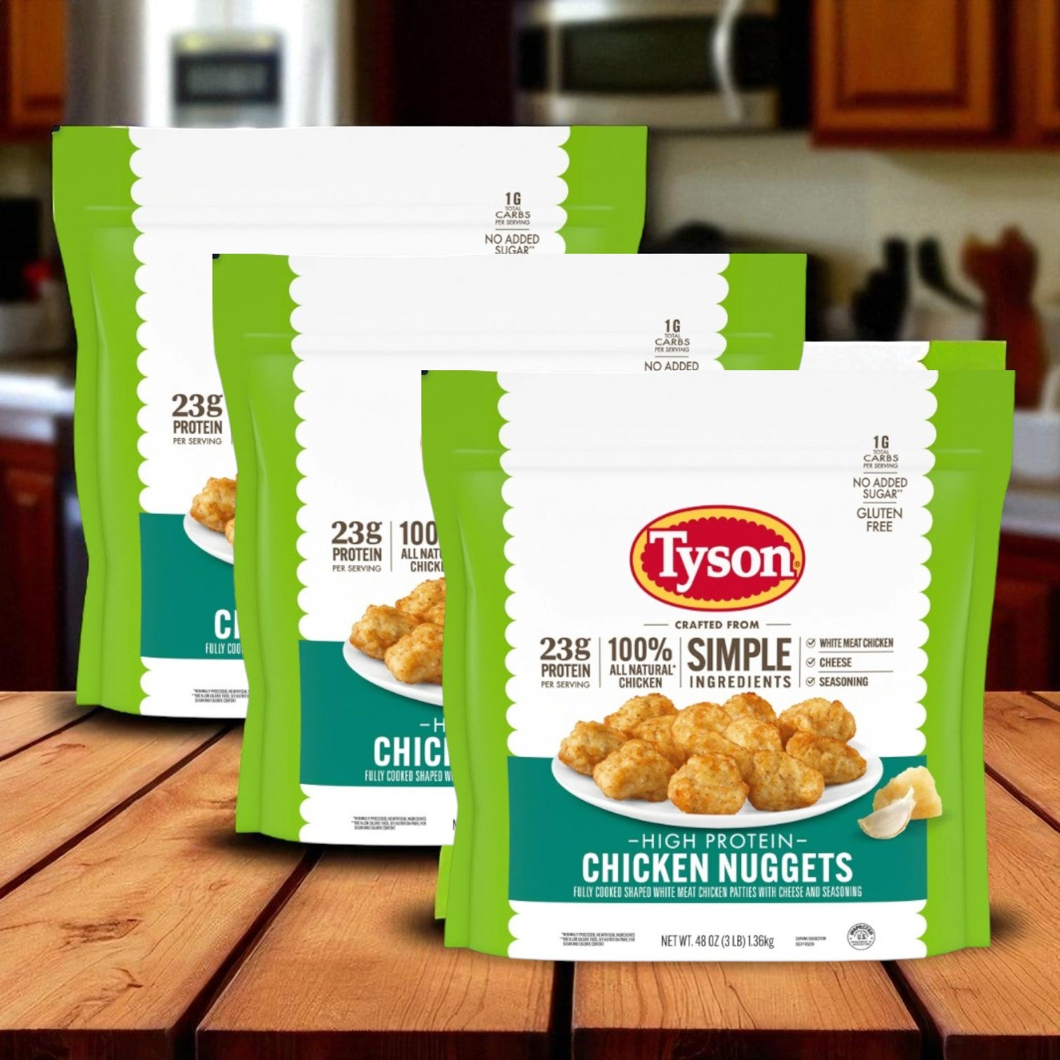 Three packages of Tyson Red Label Tempura Battered Chicken Breast Nuggets (2/5 lb bags, 10 lb total) are displayed on a wooden surface in a kitchen setting.