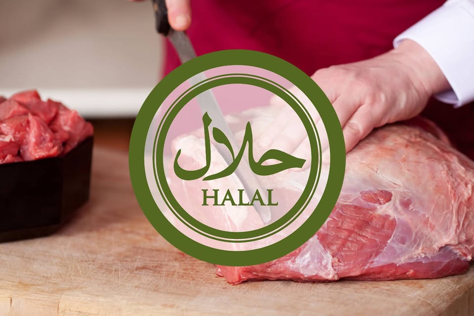 A person cuts a large piece of raw meat on a wooden board, with a "halal" certification symbol overlaid on the image.