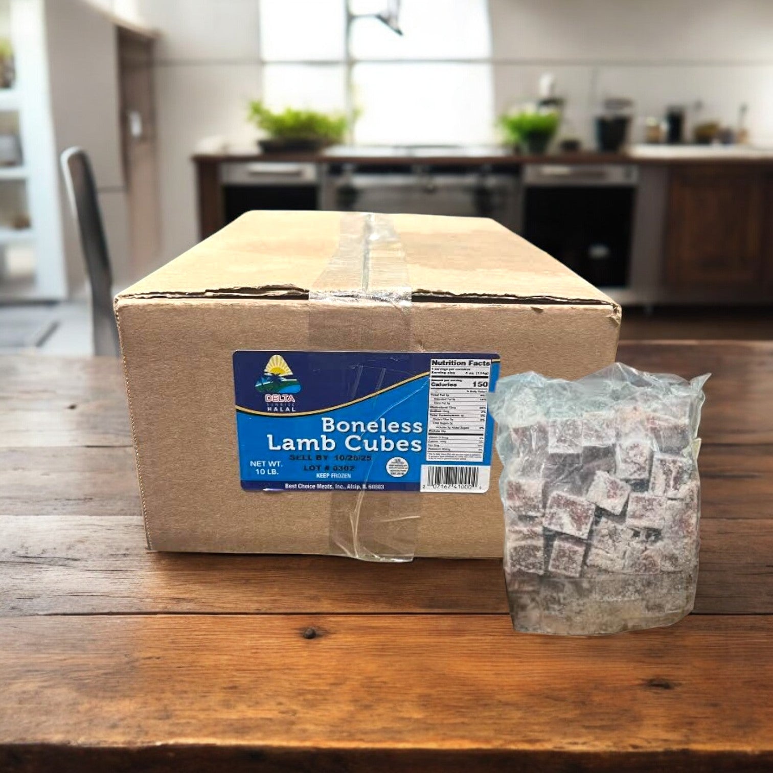 A Restaurant Depot box labeled "Boneless Lamb Cubes, 1-1.5", Halal, Australia-10 lbs-1 Case" sits on a wooden table beside a clear bag of frozen lamb cubes in a kitchen setting.