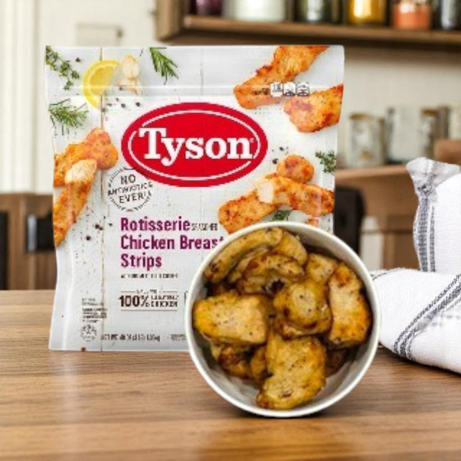 A package of Tyson Rotisserie Seasoned Unbreaded Chicken Breast Strips – 48 oz sits behind a bowl of unbreaded chicken breast strips on the kitchen counter.