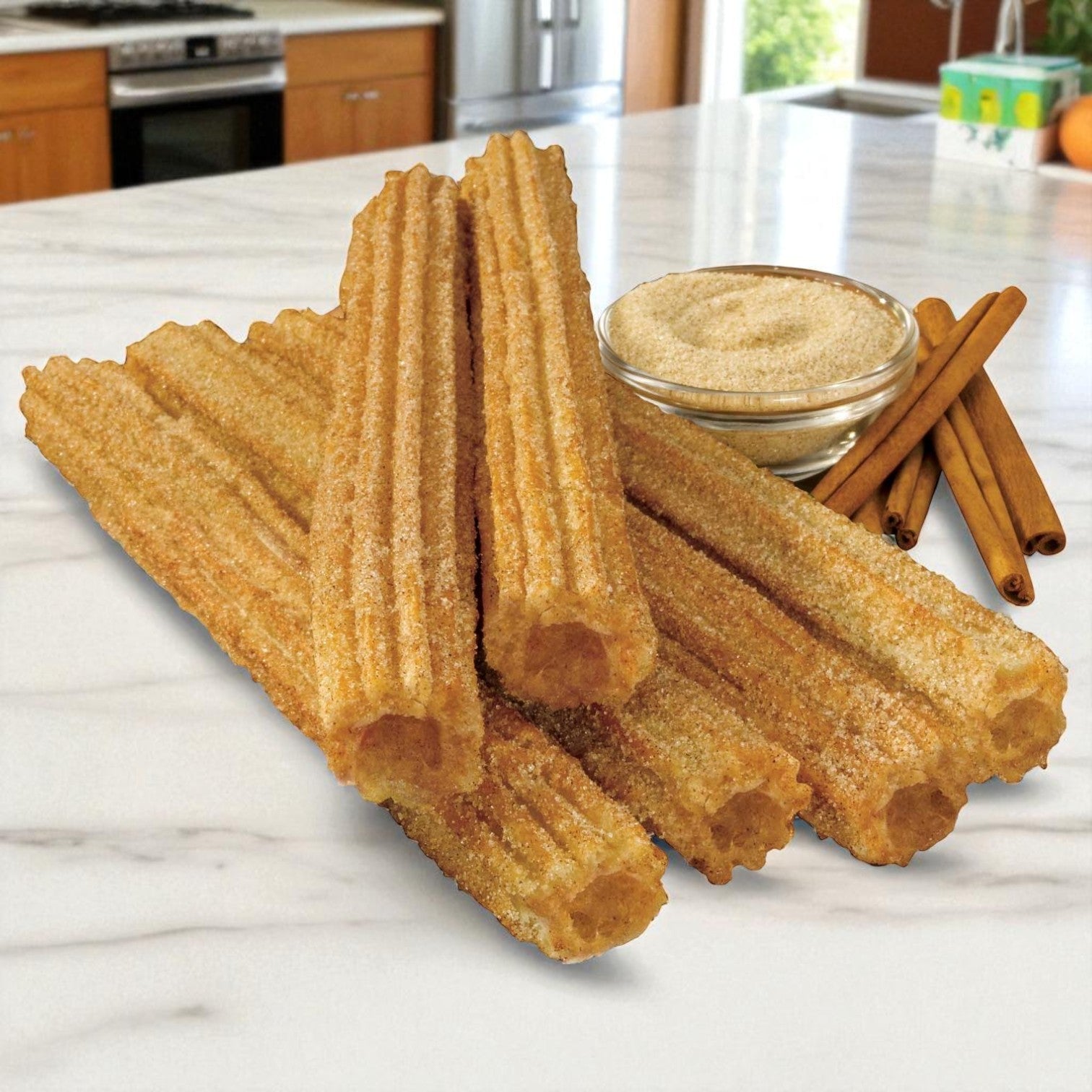 Sabor Nuestro Frozen Cinnamon & Sugar Churros – 10", 2 oz each (50 ct) are arranged on a marble countertop, with a bowl of sugar and cinnamon sticks in the background.