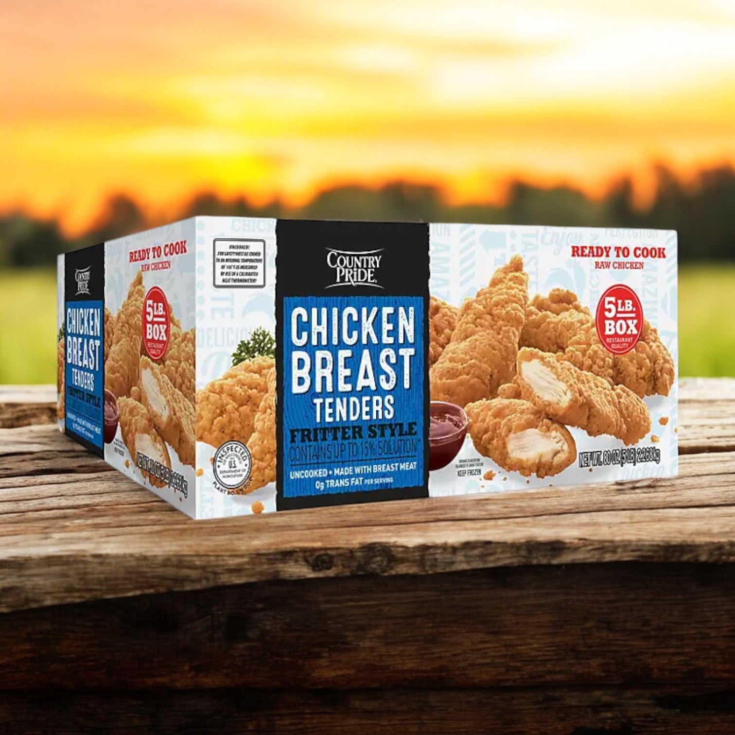 Country Pride Ready to Cook Chicken Breast Tenders, a high-protein product weighing 5 lbs. per box, placed on a wooden surface with a blurred natural background.