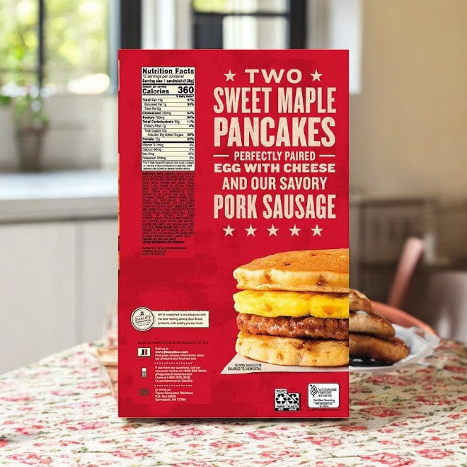 A case of Jimmy Dean Sweet Maple Griddle Cake Breakfast Sandwiches, containing 12 count, is on the table, offering savory delights with egg, cheese, and pork sausage.