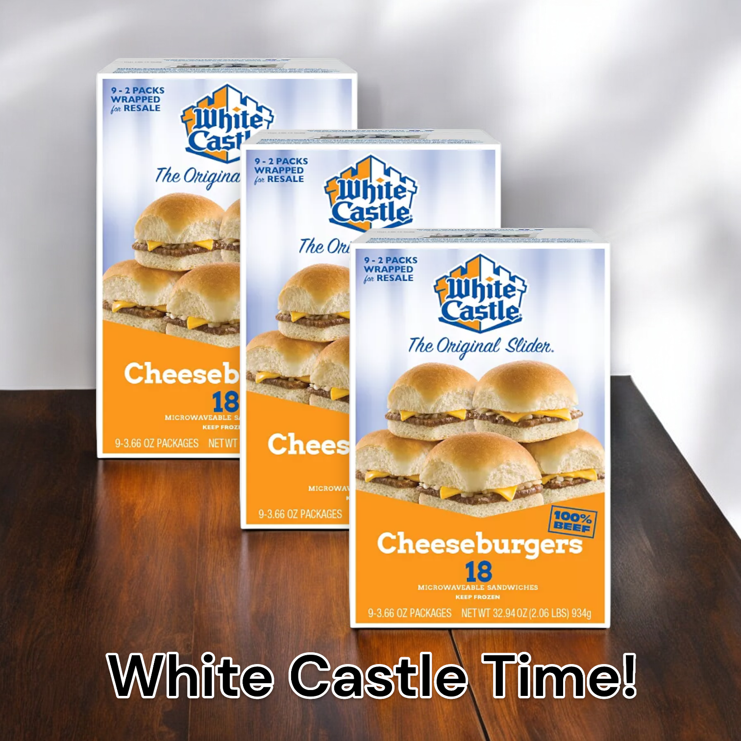 Three boxes of easylunches White Castle Time! 3 - 18 Count Cheeseburger Sliders are displayed on a wooden surface. Each box contains 18 frozen cheese sliders, wrapped for resale, totaling 54 sliders. The text "White Castle Time!" appears at the bottom, making it clear that these microwave snacks are ready when you are.