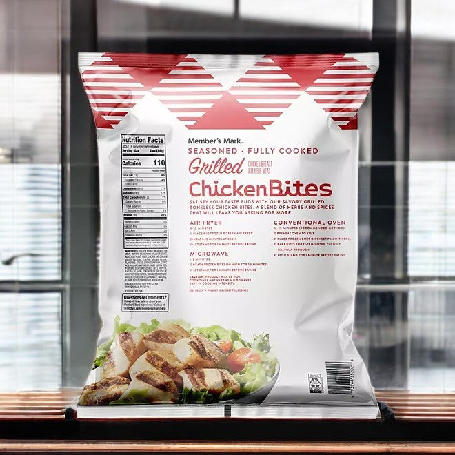 Bag of Member's Mark Grilled Chicken Bites, Frozen (3 lbs, 3 Bags for a total of 9 Pounds) showcasing nutrition facts and cooking instructions against a blurred city backdrop. Experience high-quality Member's Mark products at competitive prices.