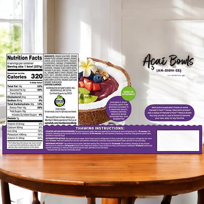 A package of Member's Mark Organic Acai Bowl, Frozen, 4 Ct, 3 Boxes rests on a wooden table, showcasing the brand's dedication to producing high-quality items. The packaging displays nutritional information, thawing instructions, and an illustration of a fruit-topped bowl.