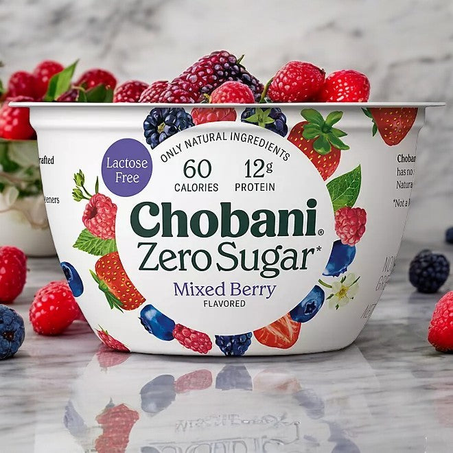 The Chobani Zero Sugar Nonfat Blended Greek Yogurt Variety Pack features vibrant raspberry, strawberry, blueberry, and blackberry images on its container with a marble background. The label emphasizes 60 calories and 12g of protein, delivering satisfaction without the sugar.