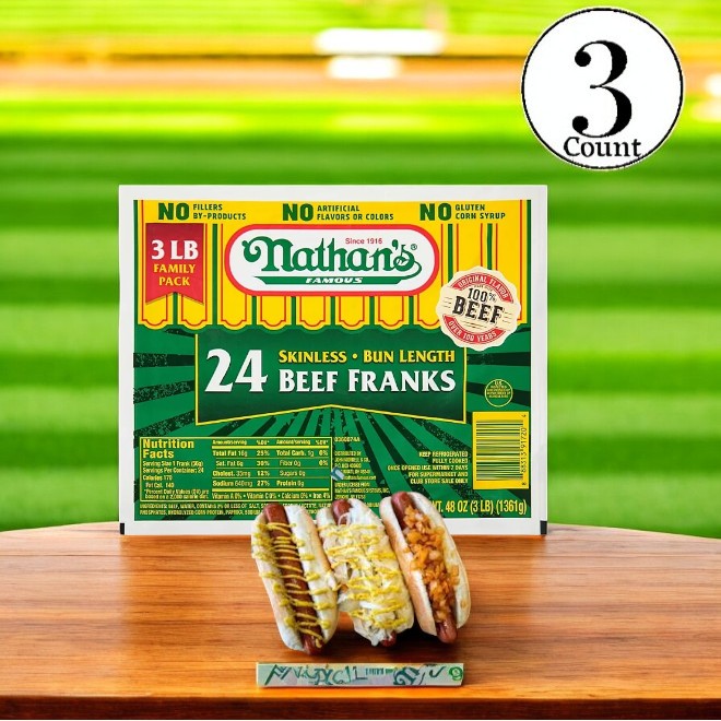 Displayed on the table is a package of Nathan's Famous Beef Franks- 3 Count, accompanied by three premium beef hot dogs nestled in buns.