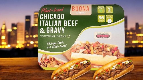 The packaging of Buona's Plant-based Chicago Italian Beef & Gravy sandwich is displayed before a blurred city skyline, highlighting its vegan and vegetarian credentials as a savory cruelty-free option.