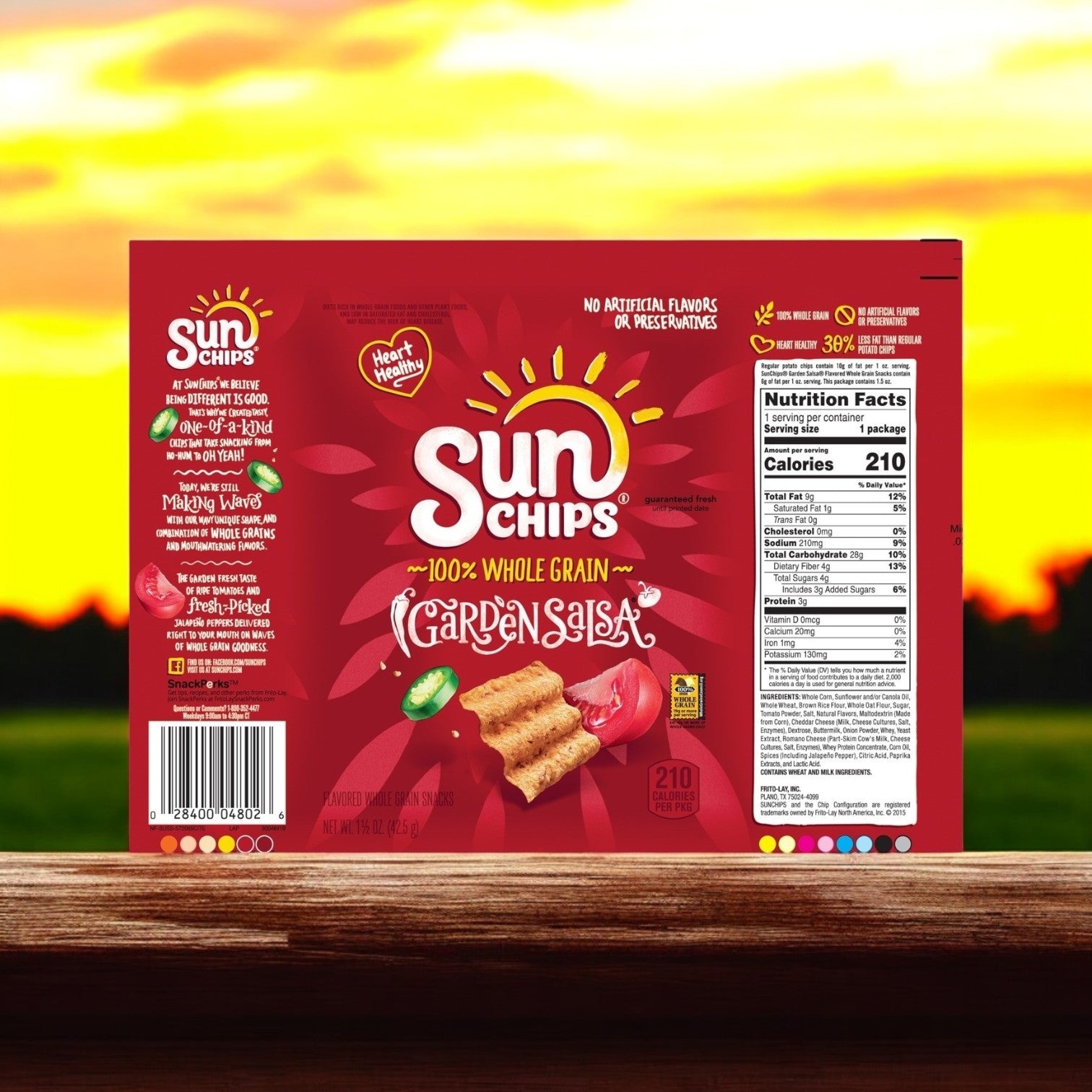 A single-serving bag of Sun Chips Multigrain Garden Salsa (64/1.5 oz) rests on a wooden surface, showcasing vibrant packaging and nutritional details emphasizing whole grains.