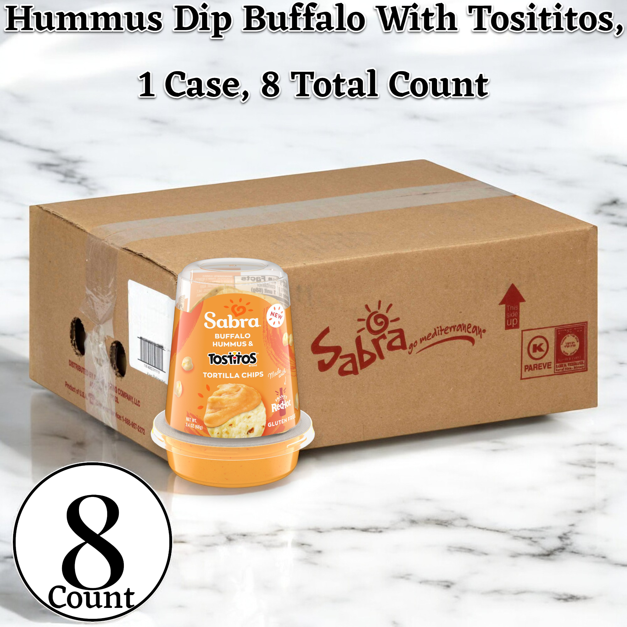 A cardboard box labeled "Sabra" containing a case of Hummus Dip Buffalo With Tostitos, 2.4 oz. - 8 Pack is shown. One cup, filled with buffalo-flavored hummus, is displayed in front of the box.