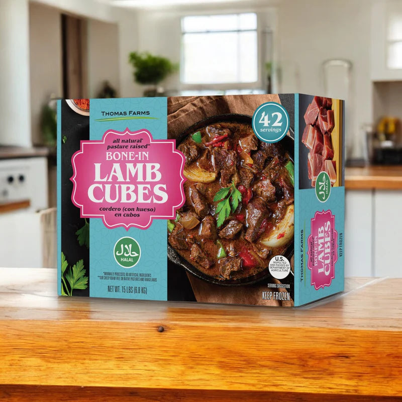 A box of Thomas Farms 3-Pack Halal Meat Bundle rests on a wooden counter in a modern kitchen, displaying an image of cooked meat and product details on the packaging.