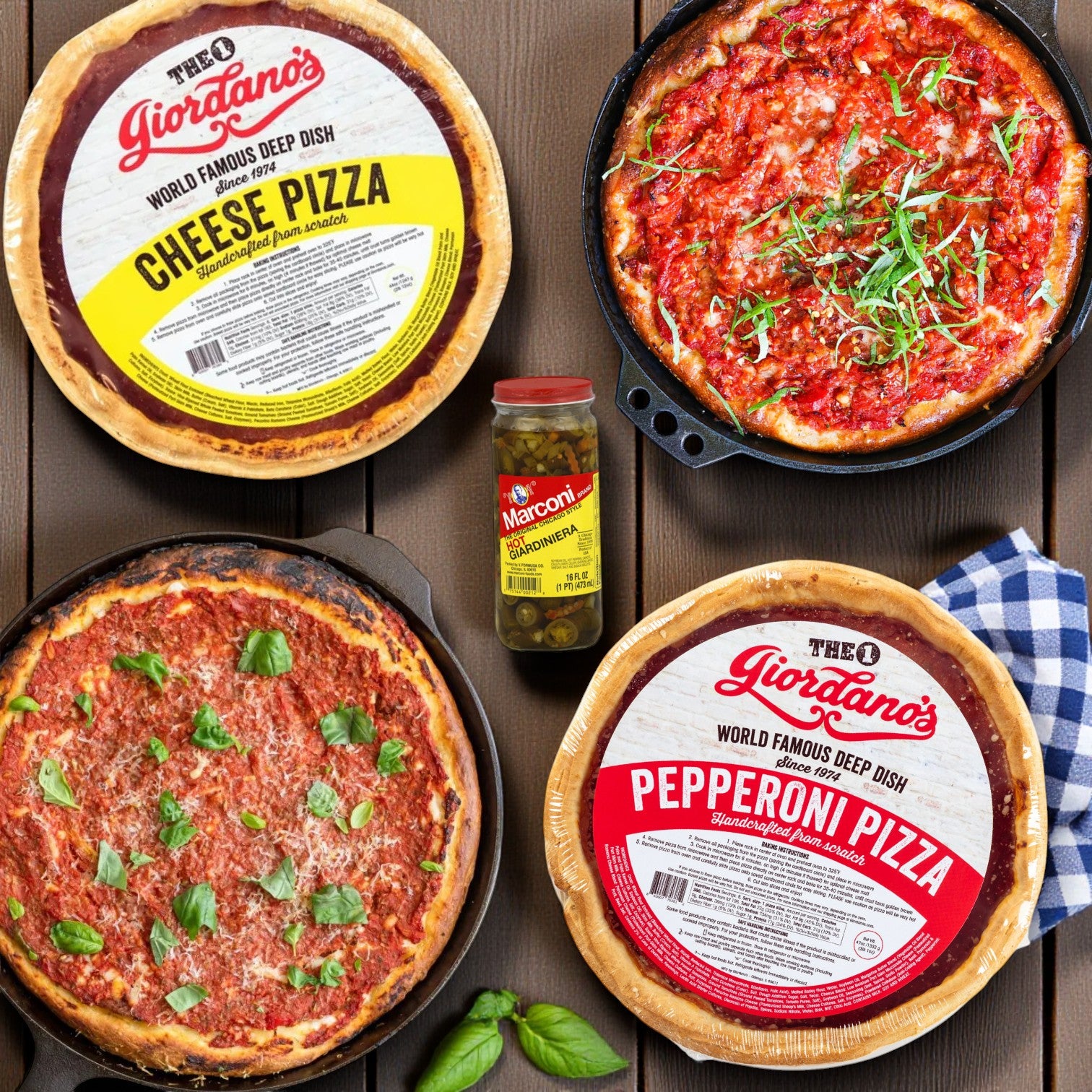 Giordano's Pepperoni Deep Dish Pizza and Cheese Pizza from Chicago's Best—Iconic Eats from the Windy City—are served with Hot Marconi Giardiniera, fresh basil, and a blue-checked napkin on a wooden table.
