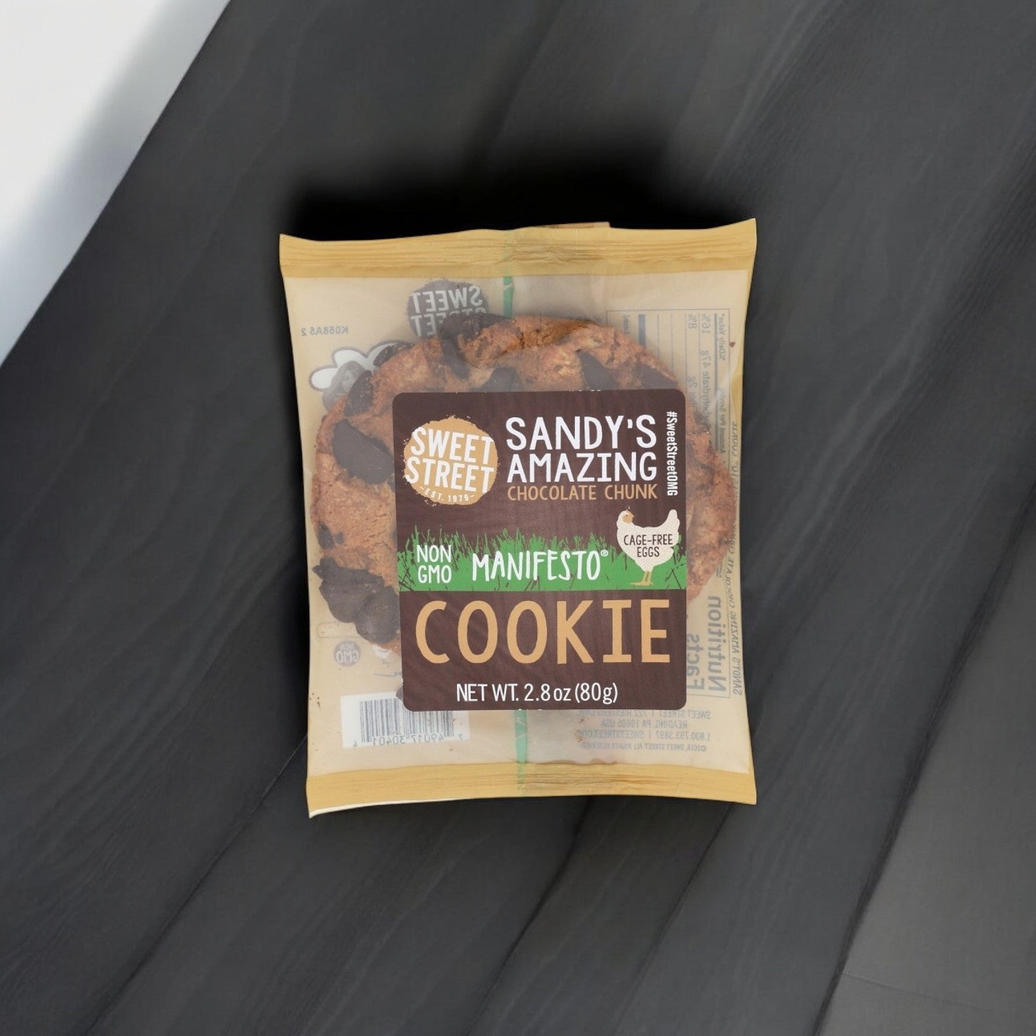 The Sweet Street "Sandy's Amazing Chocolate Chunk" 2.8 oz Manifesto cookie, a premium dessert option, is made with non-GMO ingredients and cage-free eggs. Available in a pack of 48.