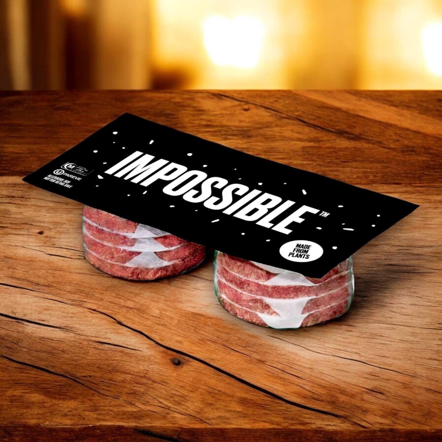 Packets of Impossible Burger 1/4 pound plant-based patties from Impossible Foods are displayed on a wooden surface; the black label boldly features "Impossible" in white letters, highlighting their non-GMO vegetarian ingredients.