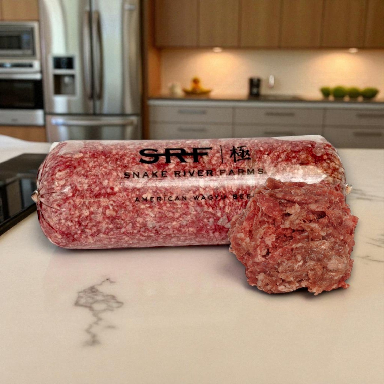 A roll of Restaurant Depot Snake River Farms Beef Ground – American Style Wagyu 75% Bulk, 4/5 lb avg, sits on a kitchen counter with a portion cut and placed in front.