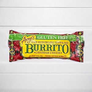 An Amy's Kitchen Southwestern Burrito, 5.5 oz - 1 Burrito, from the brand Amy's, is made with organic pinto beans, rice, and cheddar cheese. It is gluten-free and comes in red and yellow packaging, placed on a white surface.