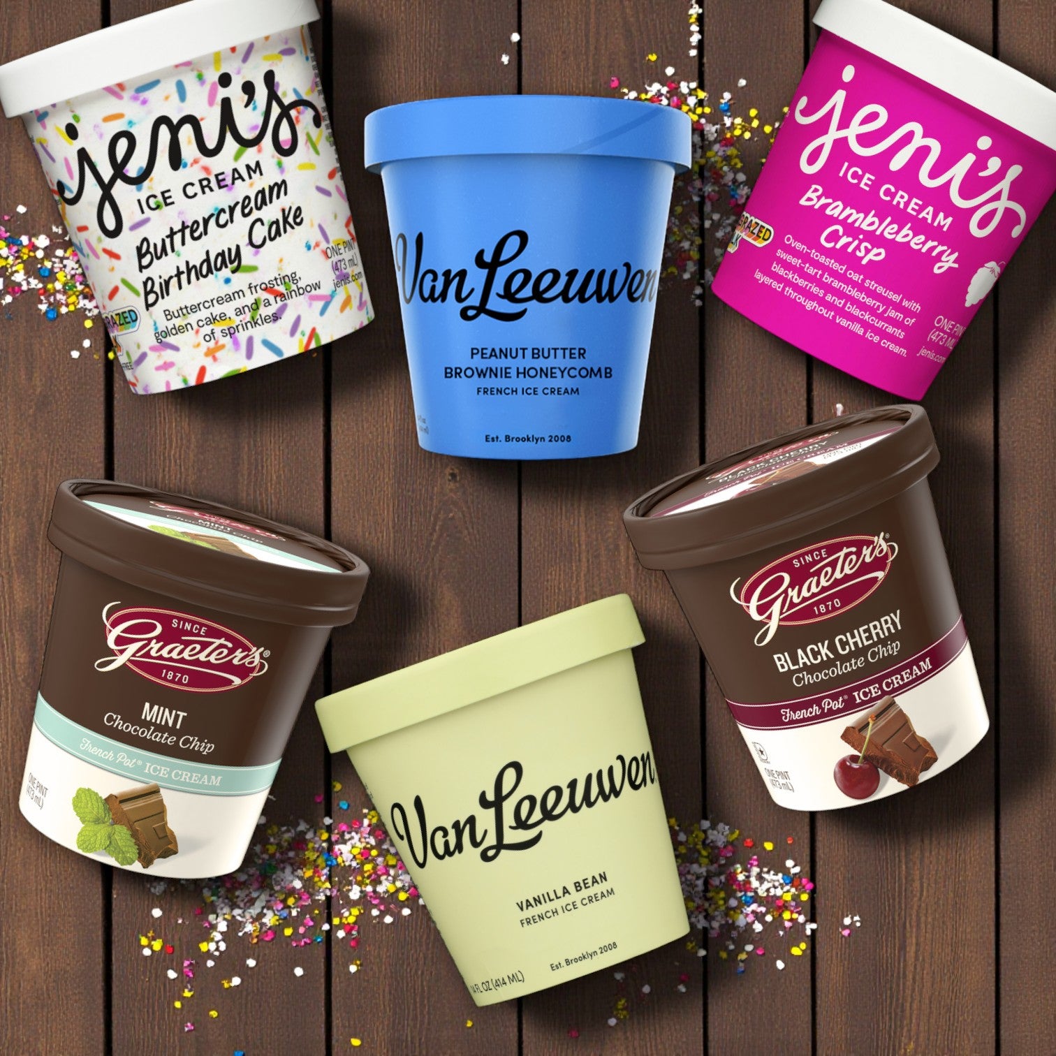 Six pints from the Easy Lunches Premium Ice Cream Lovers Combo are arranged on a brown surface in a circle, surrounded by colorful sprinkles for the ultimate ice cream experience.