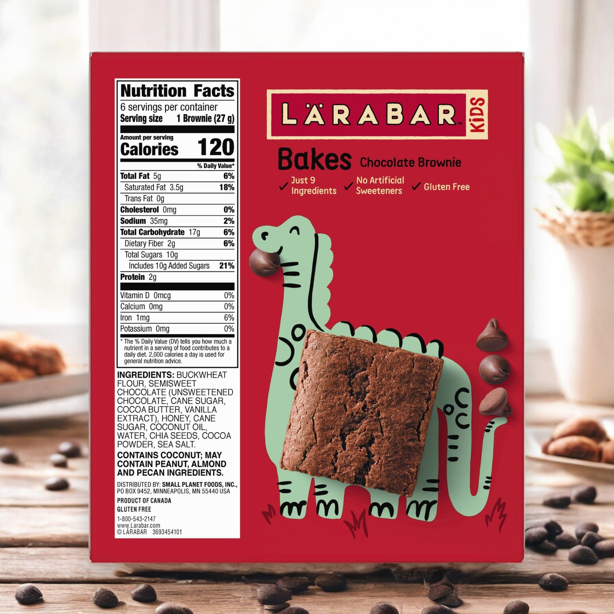 A box of Larabar Kids Chocolate Brownie Gluten Free Bars (0.96 oz - 1 Count) made by Larabar, featuring a green dinosaur design. The front displays a brownie and nutrition facts, emphasizing that these delicious treats are Gluten-Free and Non-GMO.