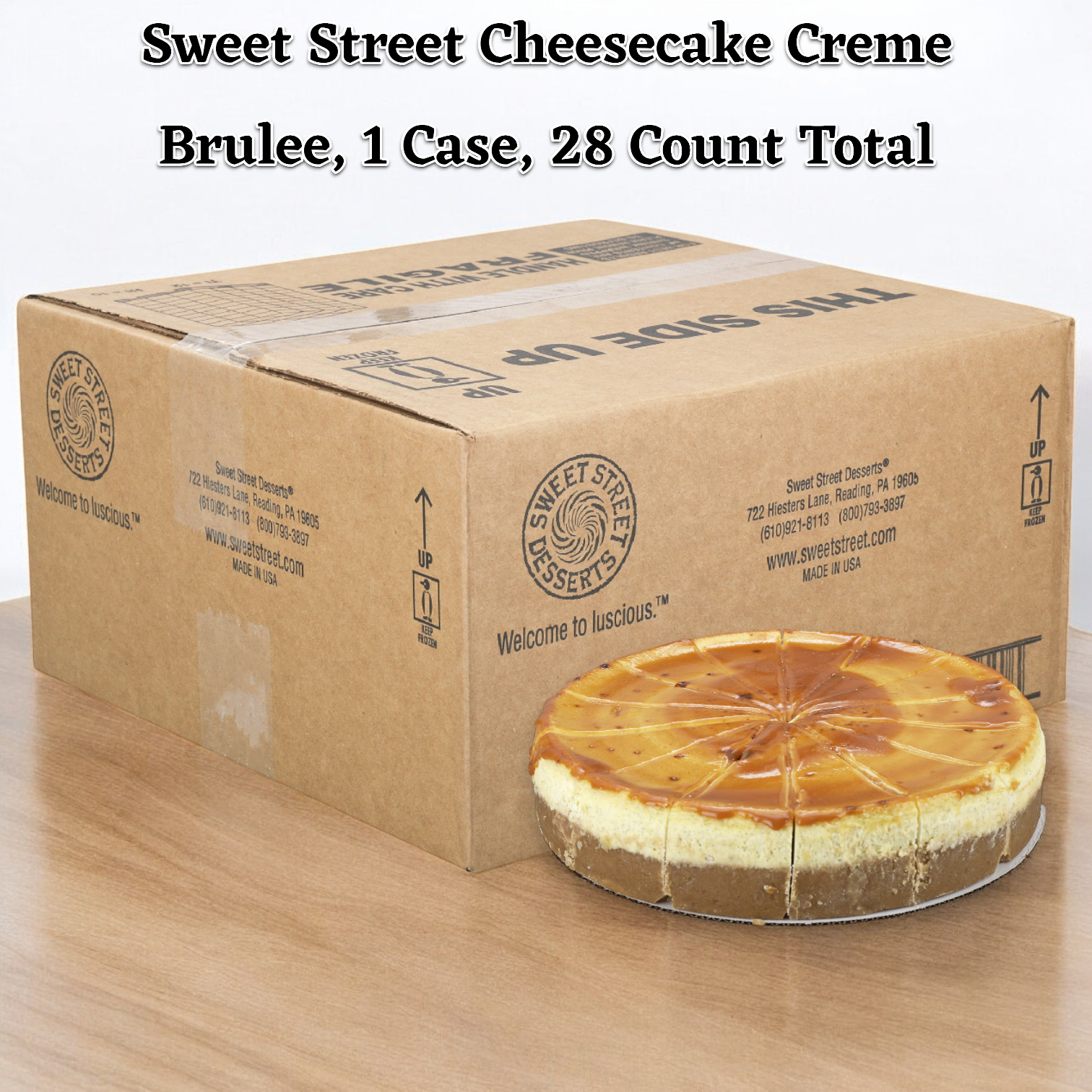 A boxed case containing a cheesecake is elegantly placed on a wooden table. The label reads "Sweet Street Cheesecake Creme Brulee, 1 Case, 28 Count Total," highlighting its perfect caramelized sugar crust.