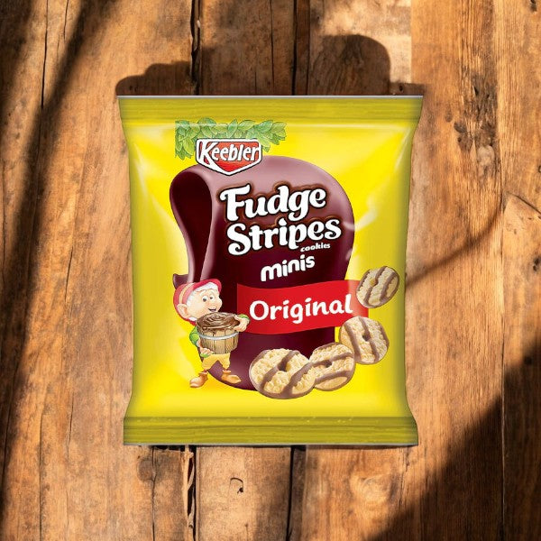 A bag of Keebler Fudge Strips-2 oz cookies, featuring genuine Keebler fudge and buttery shortbread in the "Original" flavor, placed on a wooden surface with shadows.