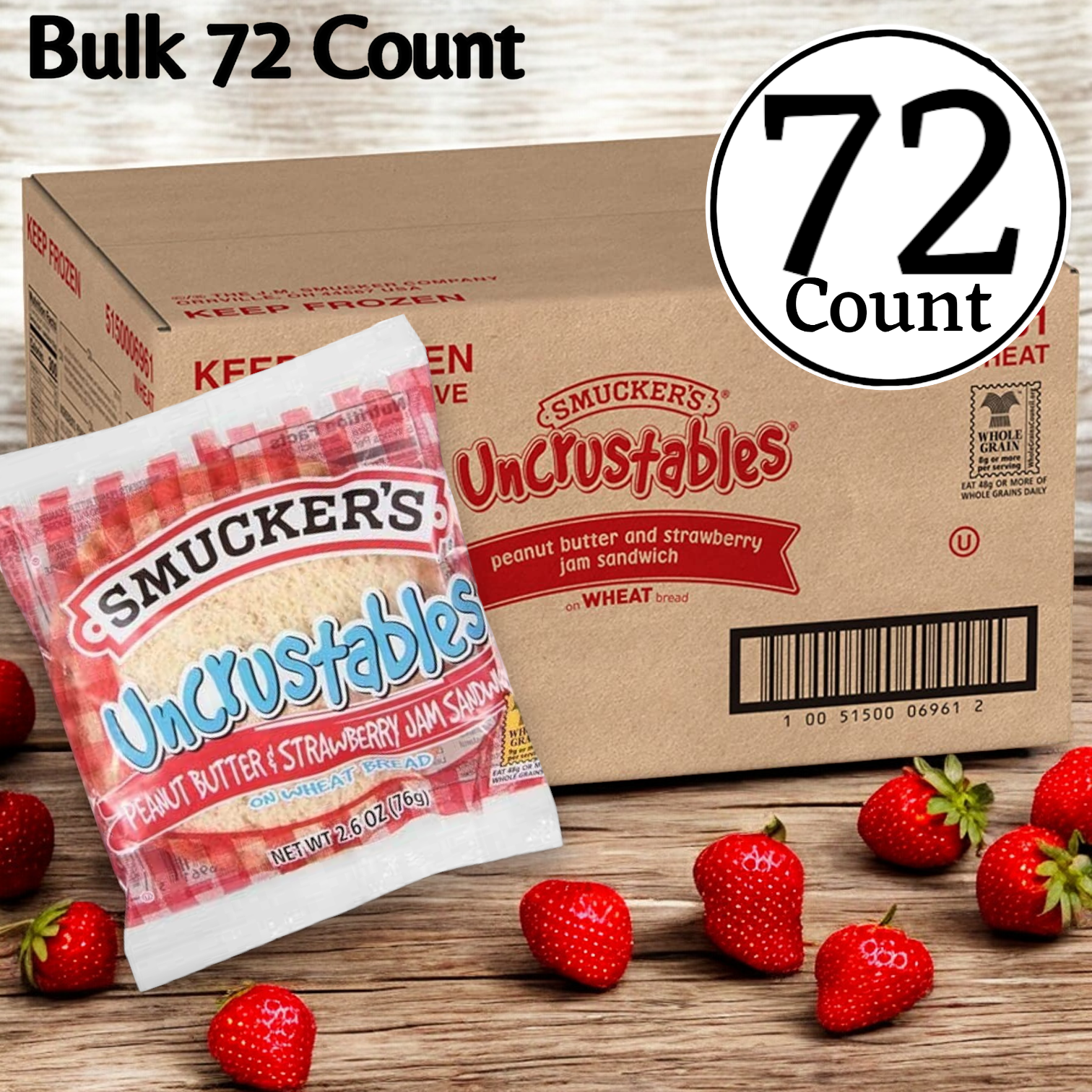 Box of 72 Uncrustable Smuckers, featuring Strawberry Jam sandwiches with creamy peanut butter. Each individually wrapped sandwich is showcased in front, surrounded by fresh strawberries and filled with sweet strawberry jam.