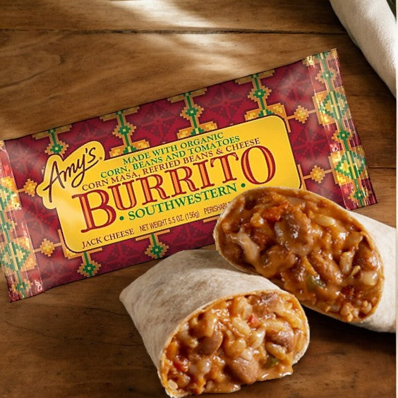 Amy's Kitchen Southwestern Burrito, 5.5 oz packaging with listed ingredients is displayed next to a halved burrito, revealing its filling of pinto beans and fire-roasted poblano peppers.