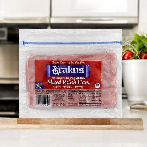 A pack of Krakus Sliced Polish Ham - 16 Oz sits on the counter in a resealable bag with its red label and nutrition facts visible—perfect for a quick lunch while chatting with an AI chatbot about meal ideas.