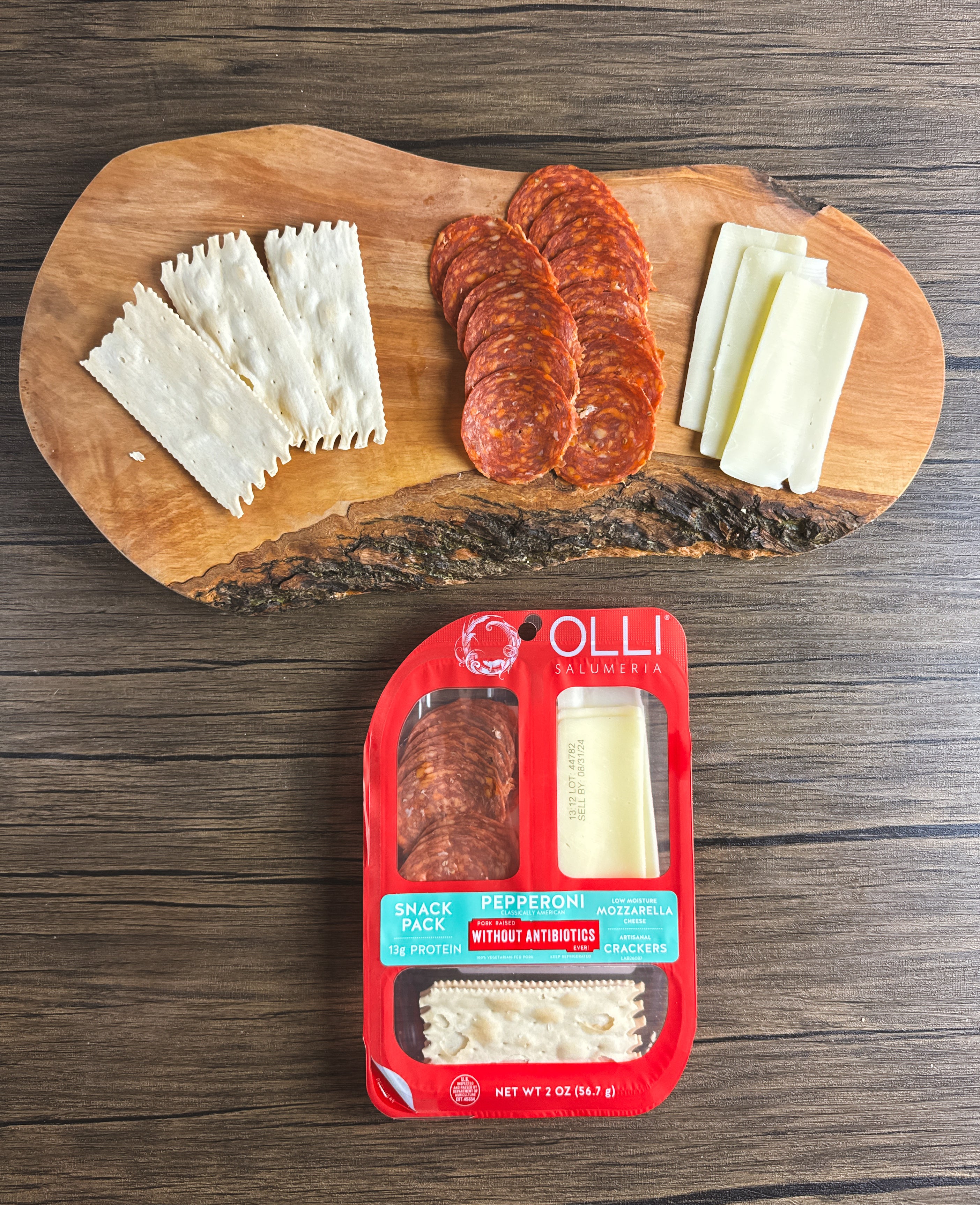 A wooden board with crackers, pepperoni slices, and cheese slices. Below, an Olli Salumeria Snack Pack Genoa featuring artisanal Italian flavors with Genoa salami, mozzarella, and crackers.