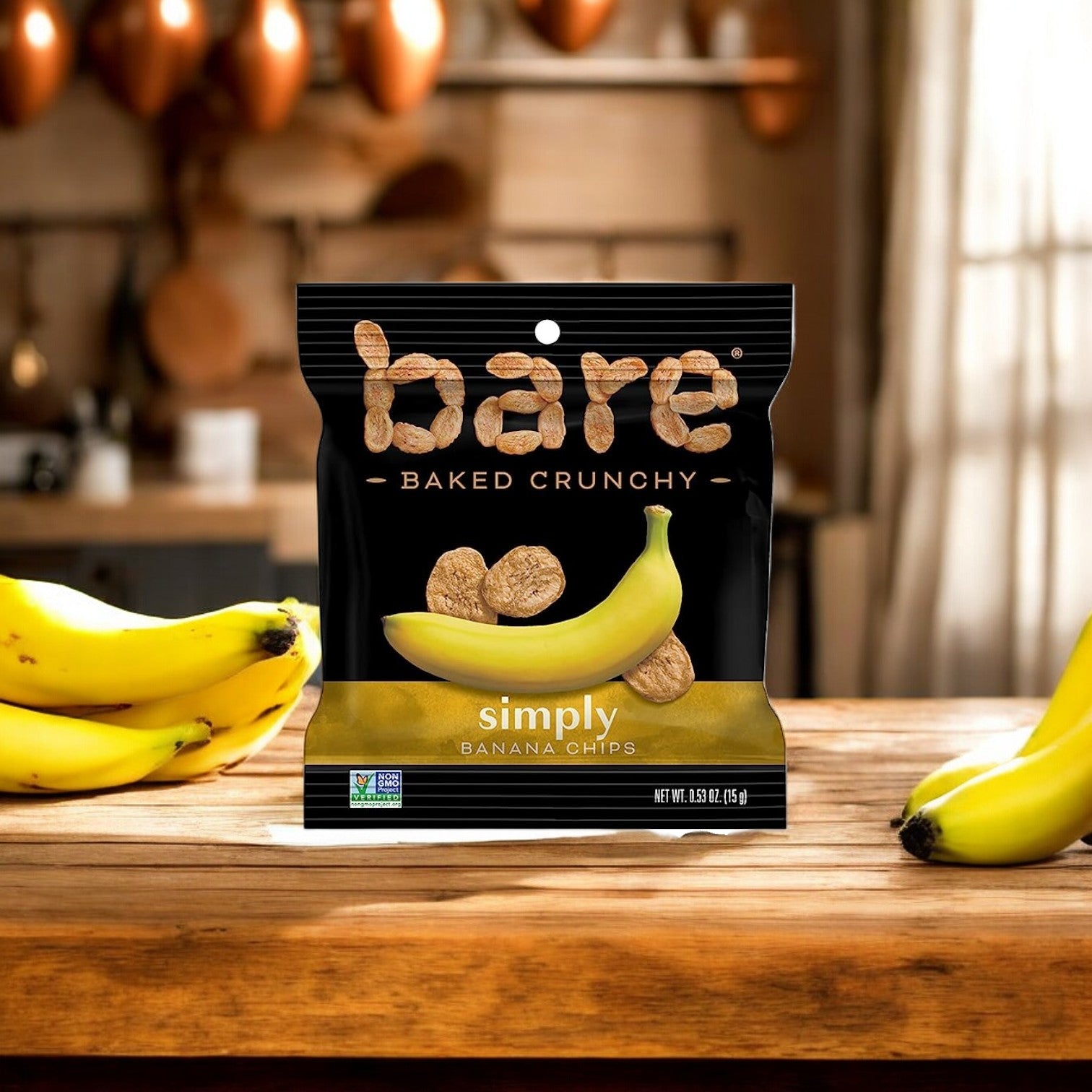 Package of Easy Lunches Bare Baked Crunchy Simply Banana Flavor chips, 0.53 oz., 1 count, on a wooden counter with fresh bananas in the background—a healthy snack option.