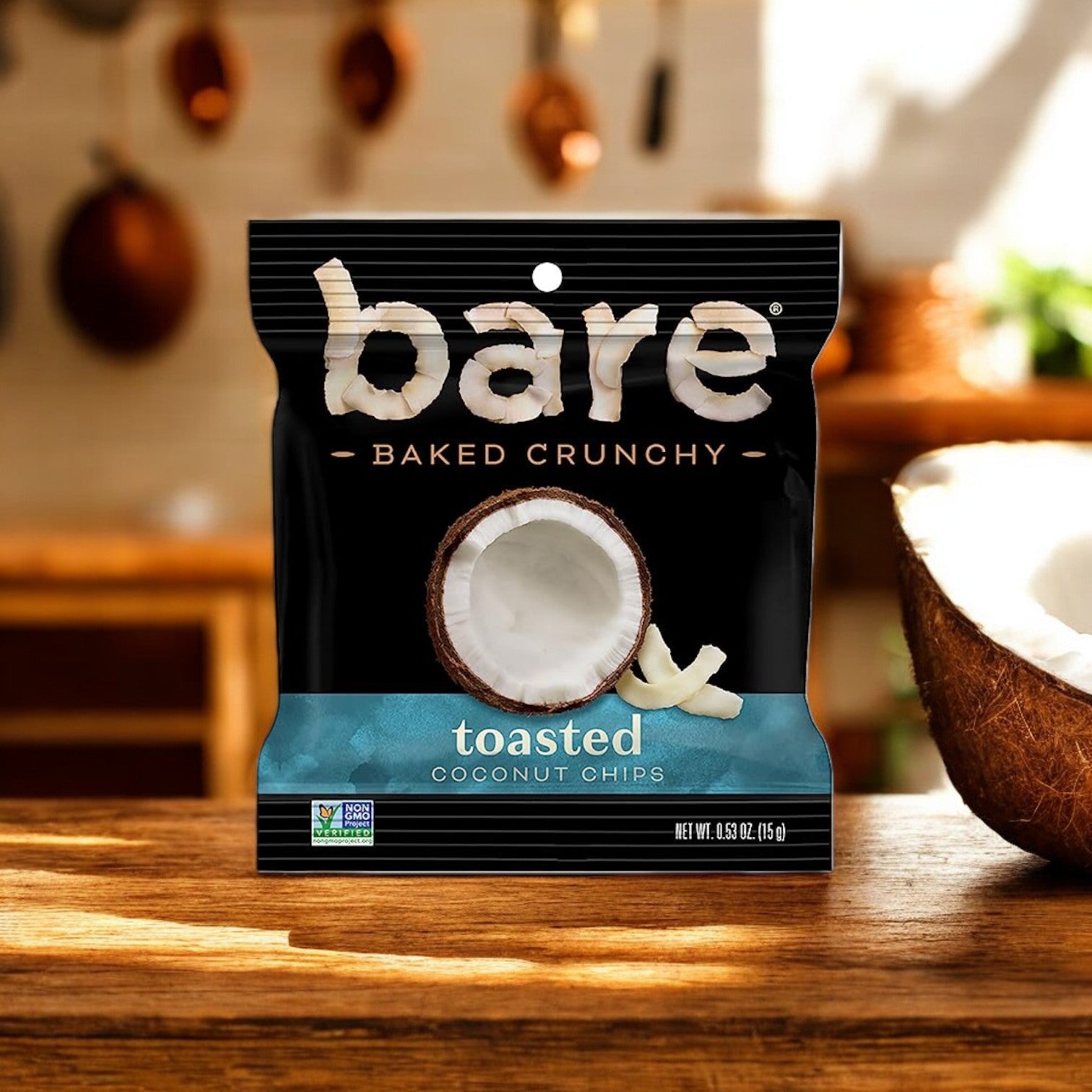 A package of Easy Lunches' Bare Baked Crunchy Toasted Coconut Flavor, 0.53 oz., 1 Count, sits on a wooden countertop in a kitchen, offering the perfect healthy snack in a convenient single-serve portion.