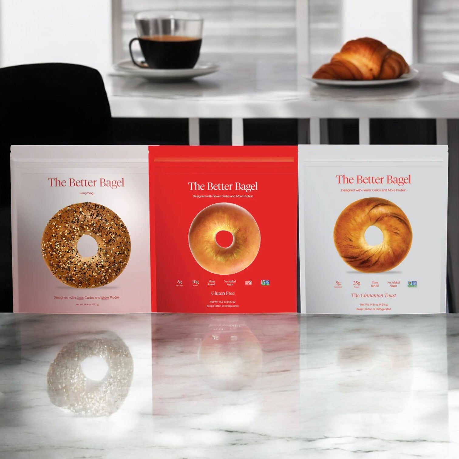 Three packages of the "BetterBrand - The BetterBrand 3 Pack Combo" are displayed on a marble surface, with a table set for breakfast in the background.