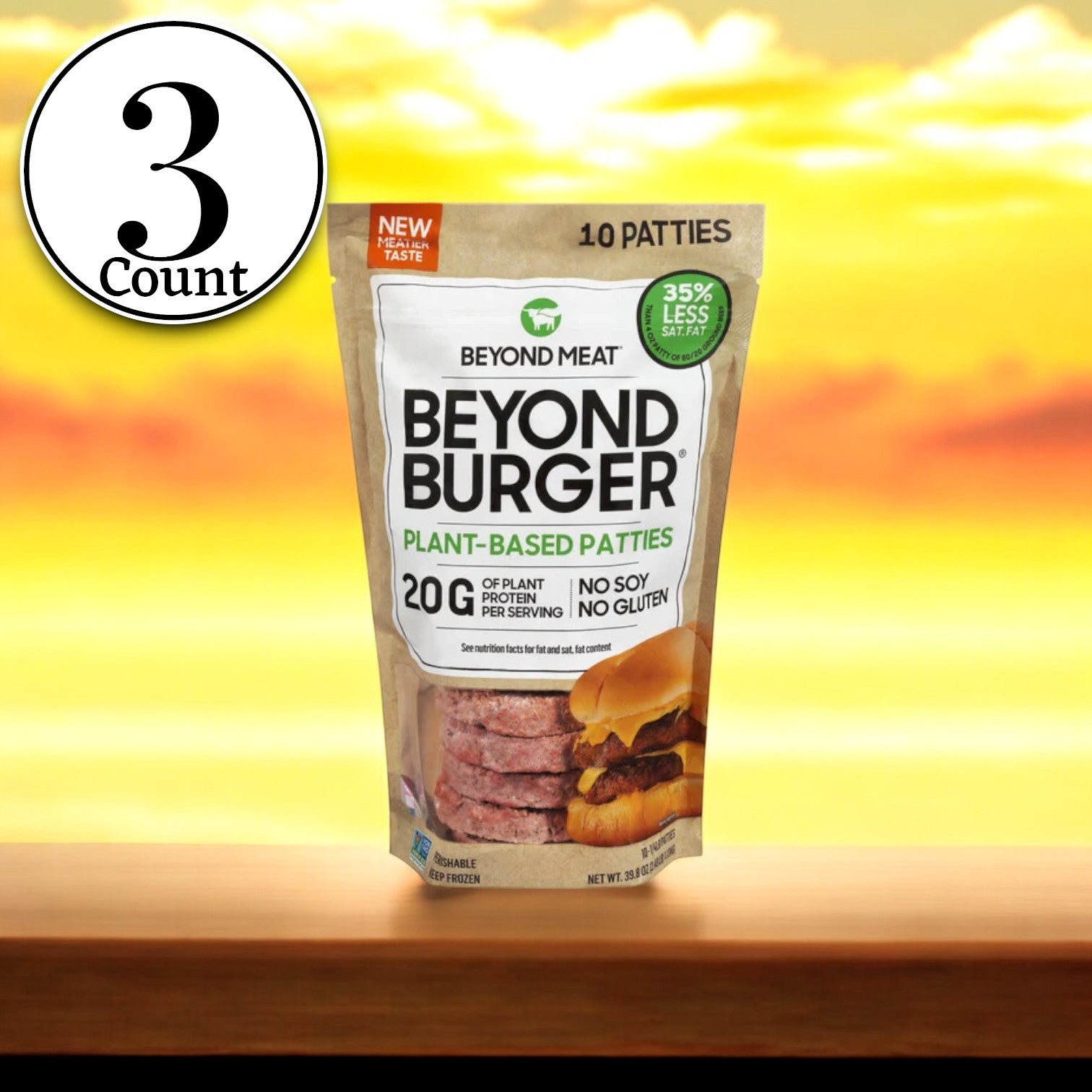 A trio of Beyond Meat Beyond Burger plant-based patties packages sits on a wooden surface against a backdrop of a sunset. Each package emphasizes features such as no soy, gluten-free, and containing 20g of protein per serving.