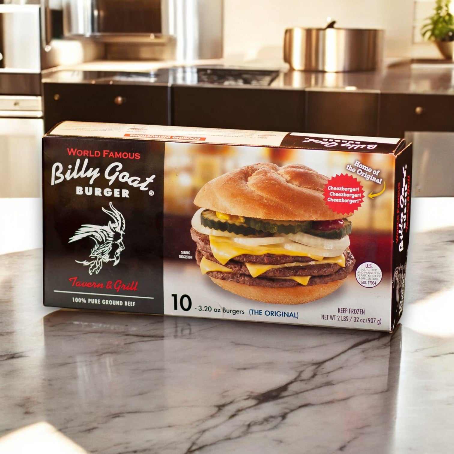 A box of Billy Goat Tavern Burgers sits on the counter, showcasing a Cheezborger with lettuce, pickles, and cheese. Labeled "World Famous" and "100% Pure Ground Beef," it delivers iconic Chicago burgers from the legendary Billy Goat brand to your home.