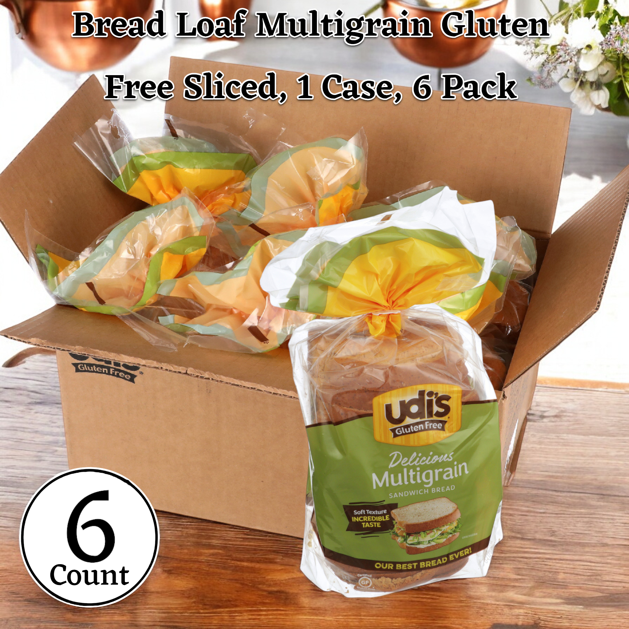 A case of six packs of Udi's Bread Loaf Multigrain Gluten Free Sliced, 24 oz., rests on a wooden surface.